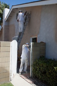 Exterior House Painting Stucco Prep Work Being Done By One Way Painting's Painters