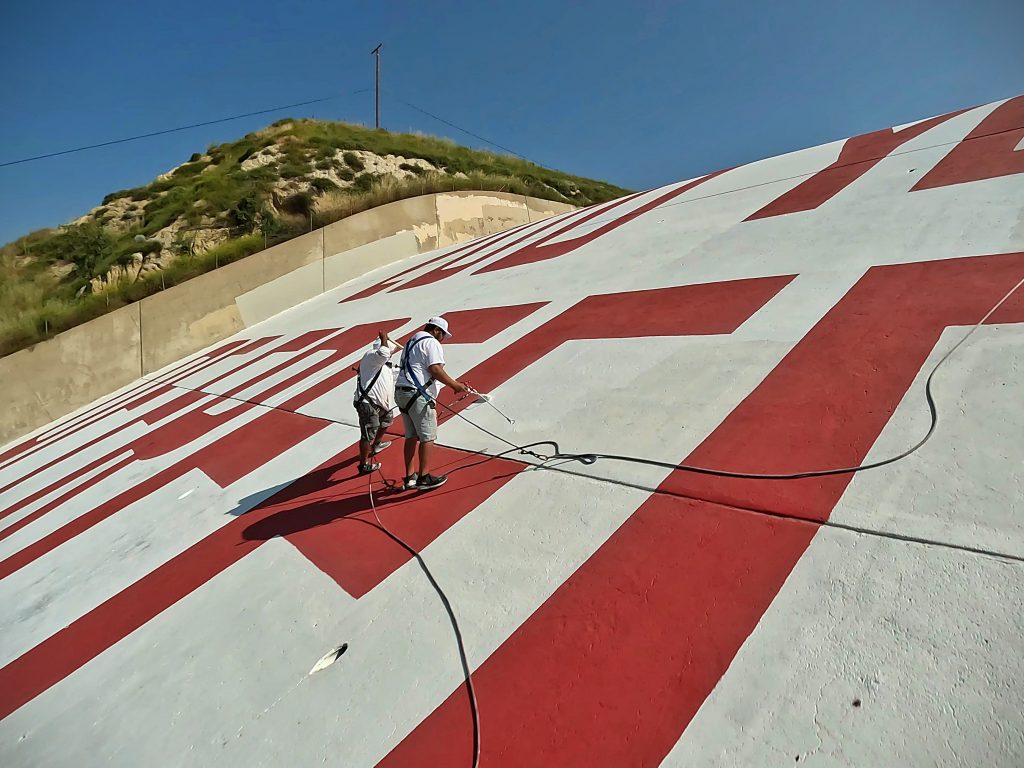 Orange County painters with One Way Painting at Prado Dam, wearing harnesses for safety