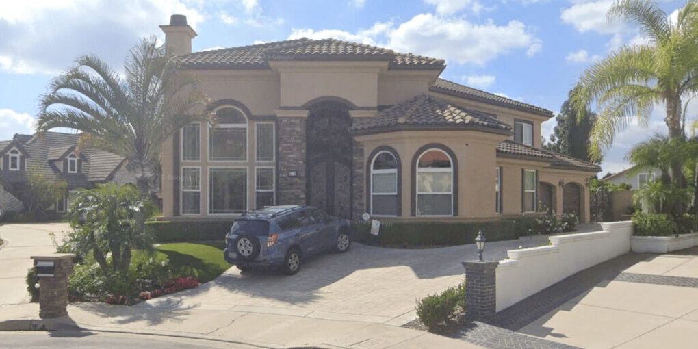 Newly painted estate in Orange Hills, showcasing stucco and detailed exterior front door and windows painting.