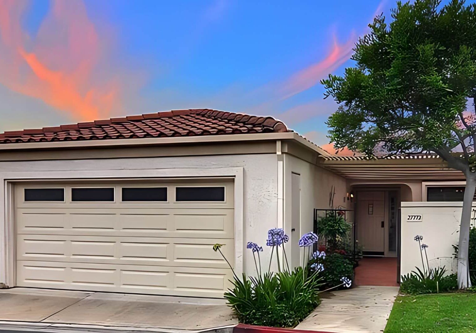 Full exterior painting project by One Way Painting house painter showcasing the freshly painted garage doors at a Mission Viejo house.