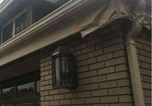 Tan rain gutters recently painted by One Way Painting to match eaves & fascia in Villa Park estate